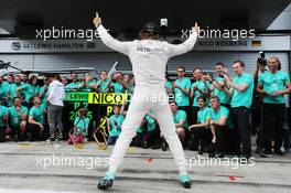 Race winner Nico Rosberg (GER) Mercedes AMG F1 celebrates with the team. 21.06.2015. Formula 1 World Championship, Rd 8, Austrian Grand Prix, Spielberg, Austria, Race Day.