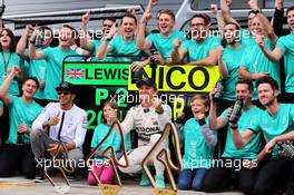 Race winner Nico Rosberg (GER) Mercedes AMG F1 and team mate Lewis Hamilton (GBR) Mercedes AMG F1 celebrate with the team. 21.06.2015. Formula 1 World Championship, Rd 8, Austrian Grand Prix, Spielberg, Austria, Race Day.