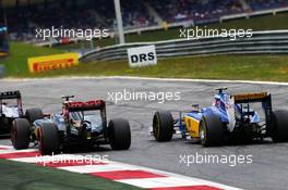 Pastor Maldonado (VEN) Lotus F1 E23 and Felipe Nasr (BRA) Sauber C34 battle for position. 21.06.2015. Formula 1 World Championship, Rd 8, Austrian Grand Prix, Spielberg, Austria, Race Day.