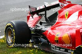 The damaged Ferrari SF15-T of race retiree Kimi Raikkonen (FIN) Ferrari. 21.06.2015. Formula 1 World Championship, Rd 8, Austrian Grand Prix, Spielberg, Austria, Race Day.