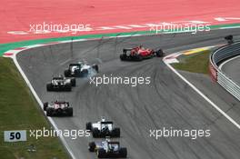 Sebastian Vettel (GER) Ferrari SF15-T leads Valtteri Bottas (FIN) Williams FW37 who locks up under braking. 21.06.2015. Formula 1 World Championship, Rd 8, Austrian Grand Prix, Spielberg, Austria, Race Day.