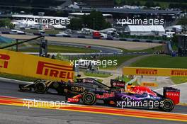 (L to R): Romain Grosjean (FRA) Lotus F1 E23 and Daniil Kvyat (RUS) Red Bull Racing RB11 battle for position. 21.06.2015. Formula 1 World Championship, Rd 8, Austrian Grand Prix, Spielberg, Austria, Race Day.