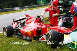 The damaged Ferrari SF15-T of race retiree Kimi Raikkonen (FIN) Ferrari. 21.06.2015. Formula 1 World Championship, Rd 8, Austrian Grand Prix, Spielberg, Austria, Race Day.