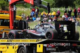 The McLaren MP4-30 of race retiree Fernando Alonso (ESP) McLaren is recovered back to the pits on the back of a truck. 21.06.2015. Formula 1 World Championship, Rd 8, Austrian Grand Prix, Spielberg, Austria, Race Day.