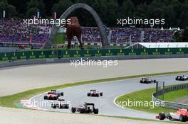 Will Stevens (GBR) Manor Marussia F1 Team follows Jenson Button (GBR) McLaren MP4-30. 21.06.2015. Formula 1 World Championship, Rd 8, Austrian Grand Prix, Spielberg, Austria, Race Day.