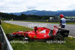 The damaged Ferrari SF15-T of Kimi Raikkonen (FIN) Ferrari. 21.06.2015. Formula 1 World Championship, Rd 8, Austrian Grand Prix, Spielberg, Austria, Race Day.