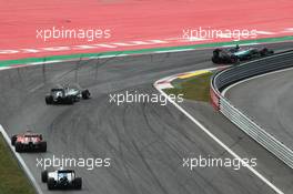 Nico Rosberg (GER) Mercedes AMG F1 W06 leads team mate Lewis Hamilton (GBR) Mercedes AMG F1 W06, Sebastian Vettel (GER) Ferrari SF15-T, and Valtteri Bottas (FIN) Williams FW37. 21.06.2015. Formula 1 World Championship, Rd 8, Austrian Grand Prix, Spielberg, Austria, Race Day.