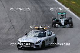 Nico Rosberg (GER) Mercedes AMG F1 W06 leads behind the FIA Safety Car. 21.06.2015. Formula 1 World Championship, Rd 8, Austrian Grand Prix, Spielberg, Austria, Race Day.