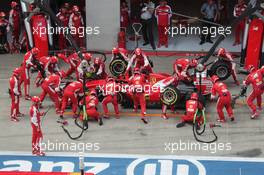 Sebastian Vettel (GER) Ferrari SF15-T has a long pit stop with a stuck rear right wheel. 21.06.2015. Formula 1 World Championship, Rd 8, Austrian Grand Prix, Spielberg, Austria, Race Day.