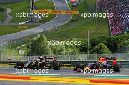 (L to R): Romain Grosjean (FRA) Lotus F1 E23 and Daniil Kvyat (RUS) Red Bull Racing RB11 battle for position. 21.06.2015. Formula 1 World Championship, Rd 8, Austrian Grand Prix, Spielberg, Austria, Race Day.