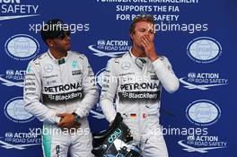 (L to R): pole sitter Lewis Hamilton (GBR) Mercedes AMG F1 with second placed team mate Nico Rosberg (GER) Mercedes AMG F1 in parc ferme. 20.06.2015. Formula 1 World Championship, Rd 8, Austrian Grand Prix, Spielberg, Austria, Qualifying Day.