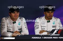 (L to R): Nico Rosberg (GER) Mercedes AMG F1 and team mate Lewis Hamilton (GBR) Mercedes AMG F1 in the FIA Press Conference. 20.06.2015. Formula 1 World Championship, Rd 8, Austrian Grand Prix, Spielberg, Austria, Qualifying Day.