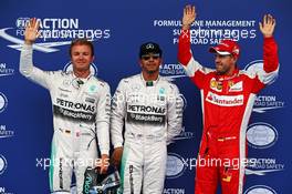 Qualifying top three in parc ferme (L to R): Nico Rosberg (GER) Mercedes AMG F1, second; Lewis Hamilton (GBR) Mercedes AMG F1, pole position; Sebastian Vettel (GER) Ferrari, third. 20.06.2015. Formula 1 World Championship, Rd 8, Austrian Grand Prix, Spielberg, Austria, Qualifying Day.