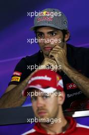 Carlos Sainz Jr (ESP) Scuderia Toro Rosso and Sebastian Vettel (GER) Ferrari in the FIA Press Conference. 18.06.2015. Formula 1 World Championship, Rd 8, Austrian Grand Prix, Spielberg, Austria, Preparation Day.