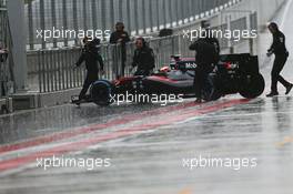 Stoffel Vandoorne (BEL) McLaren MP4-30 Test and Reserve Driver in the heavy rain. 23.06.2015. Formula 1 Testing, Day One, Spielberg, Austria, Tuesday.