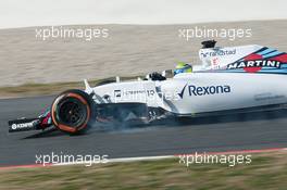 Felipe Massa (BRA) Williams FW37 locks up under braking. 20.02.2015. Formula One Testing, Day Two, Barcelona, Spain.