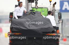 The McLaren MP4-30 of Jenson Button (GBR) McLaren is recovered back to the pits on the back of a truck. 21.02.2015. Formula One Testing, Day Three, Barcelona, Spain.