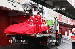 The Ferrari SF15-T of Sebastian Vettel (GER) Ferrari is recovered back to the pits on the back of a truck. 21.02.2015. Formula One Testing, Day Three, Barcelona, Spain.