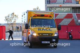 Fernando Alonso (ESP) McLaren is returned to the paddock in an ambulance. 22.02.2015. Formula One Testing, Day Four, Barcelona, Spain.