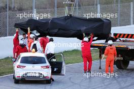 The McLaren MP4-30 of Jenson Button (GBR) McLaren is recovered back to the pits on the back of a truck. 27.02.2015. Formula One Testing, Day Two, Barcelona, Spain.