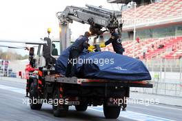 The Scuderia Toro Rosso STR10 of Carlos Sainz Jr (ESP) Scuderia Toro Rosso is recovered back to the pits on the back of a truck. 28.02.2015. Formula One Testing, Day Three, Barcelona, Spain.