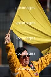 A marshal with a yellow flag. 01.03.2015. Formula One Testing, Day Four, Barcelona, Spain.