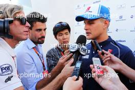 Marcus Ericsson (SWE) Sauber F1 Team with the media. 21.08.2015. Formula 1 World Championship, Rd 11, Belgian Grand Prix, Spa Francorchamps, Belgium, Practice Day.