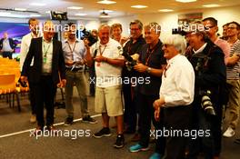 Bernie Ecclestone (GBR) joins the photographers. 21.08.2015. Formula 1 World Championship, Rd 11, Belgian Grand Prix, Spa Francorchamps, Belgium, Practice Day.