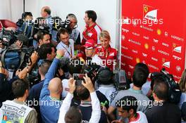 Sebastian Vettel (GER) Ferrari with the media. 21.08.2015. Formula 1 World Championship, Rd 11, Belgian Grand Prix, Spa Francorchamps, Belgium, Practice Day.
