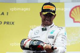 Race winner Lewis Hamilton (GBR) Mercedes AMG F1 celebrates on the podium. 23.08.2015. Formula 1 World Championship, Rd 13, Belgian Grand Prix, Spa Francorchamps, Belgium, Race Day.