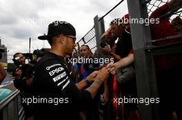 Lewis Hamilton (GBR) Mercedes AMG F1 signs autographs for the fans. 23.08.2015. Formula 1 World Championship, Rd 13, Belgian Grand Prix, Spa Francorchamps, Belgium, Race Day.