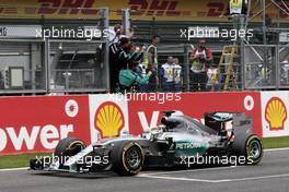 Race winner Lewis Hamilton (GBR) Mercedes AMG F1 W06 celebrates as he takes the chequered flag at the end of the race. 23.08.2015. Formula 1 World Championship, Rd 13, Belgian Grand Prix, Spa Francorchamps, Belgium, Race Day.