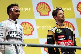 The podium (L to R): Race winner Lewis Hamilton (GBR) Mercedes AMG F1 with Romain Grosjean (FRA) Lotus F1 Team on the podium. 23.08.2015. Formula 1 World Championship, Rd 13, Belgian Grand Prix, Spa Francorchamps, Belgium, Race Day.