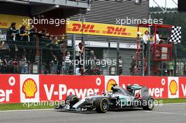 Race winner Lewis Hamilton (GBR) Mercedes AMG F1 W06 celebrates as he takes the chequered flag at the end of the race. 23.08.2015. Formula 1 World Championship, Rd 13, Belgian Grand Prix, Spa Francorchamps, Belgium, Race Day.