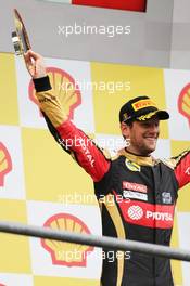 Romain Grosjean (FRA) Lotus F1 Team celebrates his third position on the podium. 23.08.2015. Formula 1 World Championship, Rd 13, Belgian Grand Prix, Spa Francorchamps, Belgium, Race Day.