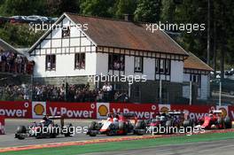 Fernando Alonso (ESP) McLaren MP4-30, Will Stevens (GBR) Manor Marussia F1 Team, and Jenson Button (GBR) McLaren MP4-30 at the start of the race. 23.08.2015. Formula 1 World Championship, Rd 13, Belgian Grand Prix, Spa Francorchamps, Belgium, Race Day.
