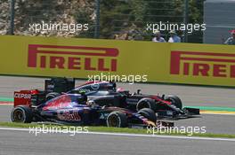 Carlos Sainz Jr (ESP) Scuderia Toro Rosso STR10 and Jenson Button (GBR) McLaren MP4-30 battle for position. 23.08.2015. Formula 1 World Championship, Rd 13, Belgian Grand Prix, Spa Francorchamps, Belgium, Race Day.
