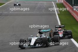 Lewis Hamilton (GBR) Mercedes AMG F1 W06 leads a lapped Jenson Button (GBR) McLaren MP4-30. 23.08.2015. Formula 1 World Championship, Rd 13, Belgian Grand Prix, Spa Francorchamps, Belgium, Race Day.