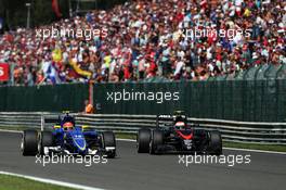(L to R): Felipe Nasr (BRA) Sauber C34 and Jenson Button (GBR) McLaren battle for position. 23.08.2015. Formula 1 World Championship, Rd 13, Belgian Grand Prix, Spa Francorchamps, Belgium, Race Day.