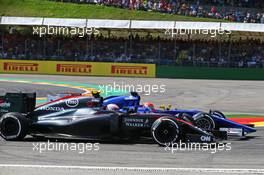 Felipe Nasr (BRA) Sauber C34 and Jenson Button (GBR) McLaren MP4-30 battle for position. 23.08.2015. Formula 1 World Championship, Rd 13, Belgian Grand Prix, Spa Francorchamps, Belgium, Race Day.