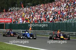 Marcus Ericsson (SWE) Sauber C34 and Daniil Kvyat (RUS) Red Bull Racing RB11 battle for position. 23.08.2015. Formula 1 World Championship, Rd 13, Belgian Grand Prix, Spa Francorchamps, Belgium, Race Day.