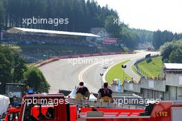 Two firemen watch the action at Eau Rouge 22.08.2015. Formula 1 World Championship, Rd 11, Belgian Grand Prix, Spa Francorchamps, Belgium, Qualifying Day.