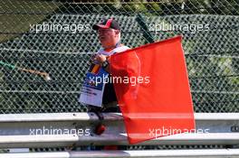 A marshal with a red flag. 22.08.2015. Formula 1 World Championship, Rd 11, Belgian Grand Prix, Spa Francorchamps, Belgium, Qualifying Day.