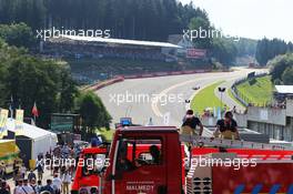 Two firemen watch the action at Eau Rouge 22.08.2015. Formula 1 World Championship, Rd 11, Belgian Grand Prix, Spa Francorchamps, Belgium, Qualifying Day.