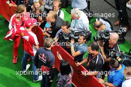 (L to R): Kimi Raikkonen (FIN) Ferrari and Max Verstappen (NLD) Scuderia Toro Rosso with the media. 20.08.2015. Formula 1 World Championship, Rd 11, Belgian Grand Prix, Spa Francorchamps, Belgium, Preparation Day.