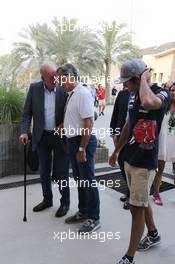 (L to R): The former Spanish King Juan Carlos with Carlos Sainz (ESP) and Carlos Sainz Jr (ESP) Scuderia Toro Rosso. 17.04.2015. Formula 1 World Championship, Rd 4, Bahrain Grand Prix, Sakhir, Bahrain, Practice Day