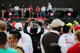 The fans' stage (L to R): Will Buxton (GBR) NBS Sports Network TV Presenter; Daniel Ricciardo (AUS) Red Bull Racing; Lewis Hamilton (GBR) Mercedes AMG F1; Nico Rosberg (GER) Mercedes AMG F1; Sebastian Vettel (GER) Ferrari; Kimi Raikkonen (FIN) Ferrari; Niki Lauda (AUT) Mercedes Non-Executive Chairman; Bernie Ecclestone (GBR); Steve Rider (GBR). 17.04.2015. Formula 1 World Championship, Rd 4, Bahrain Grand Prix, Sakhir, Bahrain, Practice Day