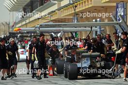 Nico Rosberg (GER) Mercedes AMG F1 W06 and Lewis Hamilton (GBR) Mercedes AMG F1 W06 in the pits. 17.04.2015. Formula 1 World Championship, Rd 4, Bahrain Grand Prix, Sakhir, Bahrain, Practice Day