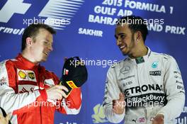 The podium (L to R): second placed Kimi Raikkonen (FIN) Ferrari with race winner Lewis Hamilton (GBR) Mercedes AMG F1. 19.04.2015. Formula 1 World Championship, Rd 4, Bahrain Grand Prix, Sakhir, Bahrain, Race Day.
