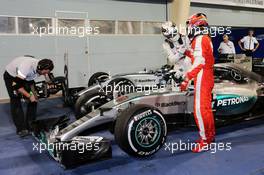 Race winner Lewis Hamilton (GBR) Mercedes AMG F1 W06 and second placed Kimi Raikkonen (FIN) Ferrari celebrate in parc ferme. 19.04.2015. Formula 1 World Championship, Rd 4, Bahrain Grand Prix, Sakhir, Bahrain, Race Day.